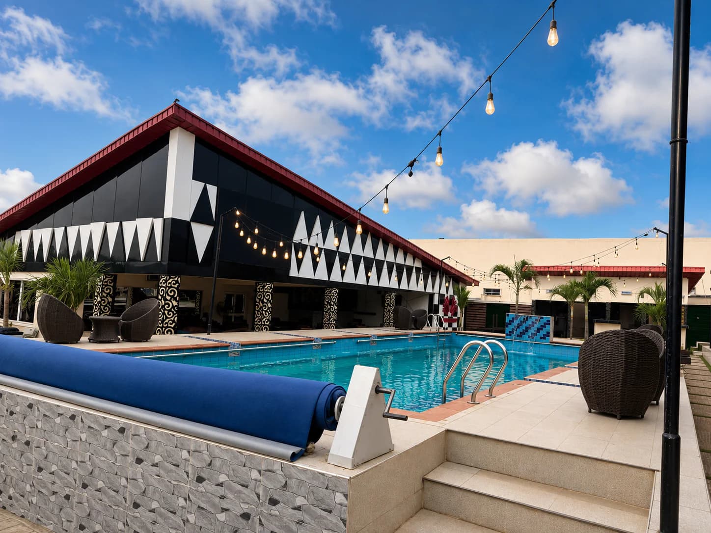 Ellysam swimming pool, poolside seating, and courtyard